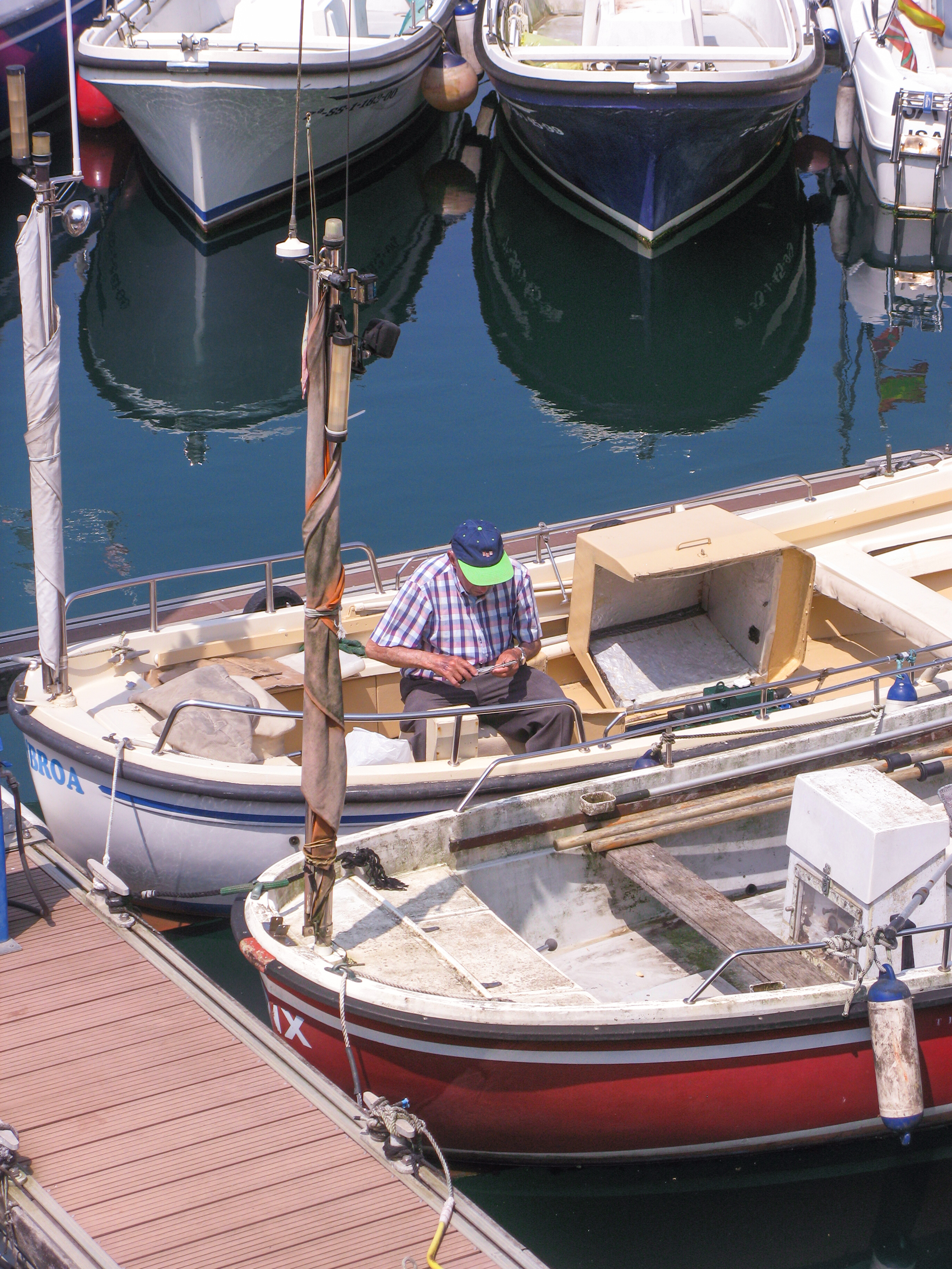 man on boat in Donostia Marina